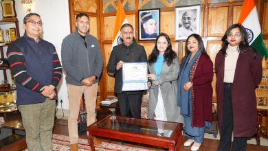 hands over land documents to Ms. Nakshatra Singh under Sukh Ashray Yojana