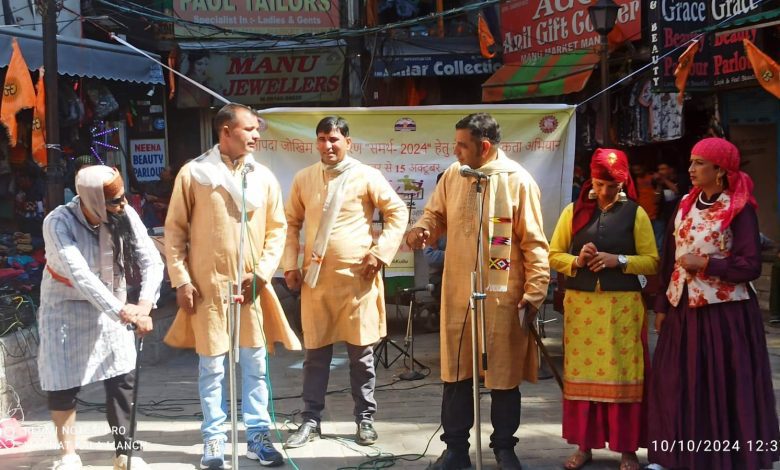 Information related to disaster management through songs and street plays by the artists of Mannat Kala Manch Kullu.